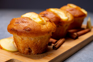 Fresh baked muffins with apple and cinnamon close up