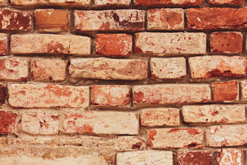 Background of old vintage dirty brick wall with peeling plaster, texture