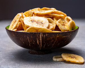 Healthy snack, crispy dehydrated unsugared banana chips in bowl