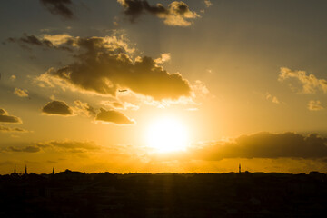 Sunset sky with dark shadow of city,close up taken.