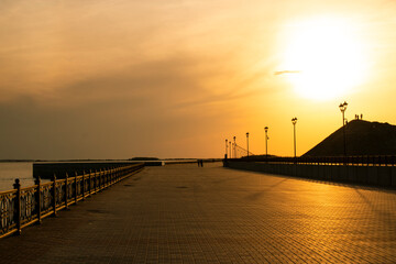 Deserted promenade during sunset