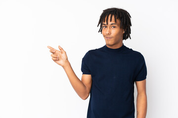 Young african american man isolated on white background pointing finger to the side