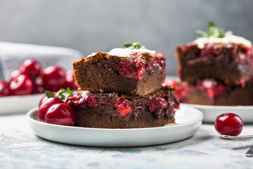  Tasty cherry brownie  or blonde lies in a plate.