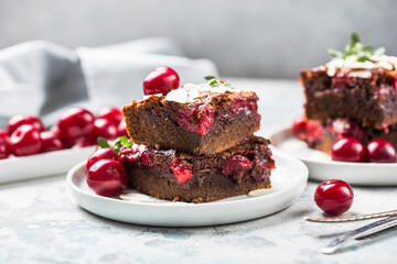  Tasty cherry brownie  or blonde lies in a plate.