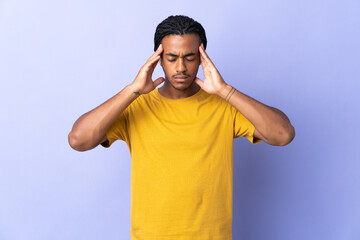 Fototapeta premium Young African American man with braids man isolated on purple background with headache