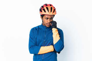 Young cyclist man with braids over isolated background with tired and bored expression