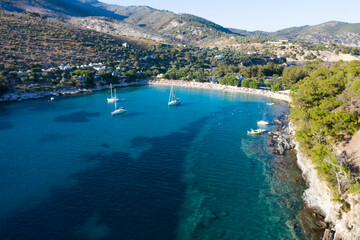 Obraz premium Sail boats in turquoise water in Thassos, Greece