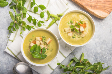 Plate of summer delicious pea  soup with green peas. Top view