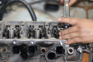 Obraz premium The mechanic is checking the engine.