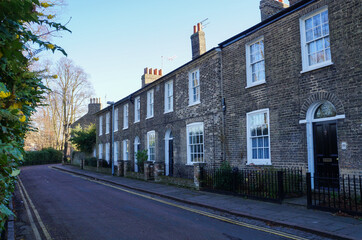 Two-storey stone house and a road in Cambridge, UK