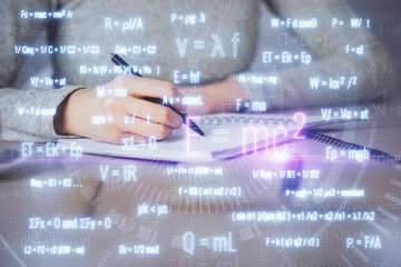 Science formula hologram over woman's hands taking notes background. Concept of study. Multi...