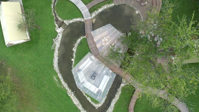 4K Drone Push Back Birds Eye Shot Of Modern House On Lake
