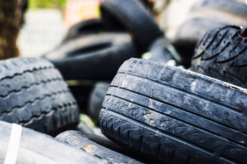 A bunch of old tires from used cars.