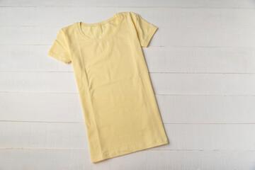 Yellow blank t-shirt unisex white background. Mockup. Knitted cotton t-shirt