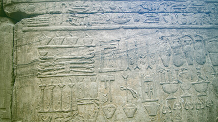 Fototapeta na wymiar Hieroglyphic in Edfu HOrus temple showing abundance of food resources corn grape culture of Egypt meal kitchen pots and jars