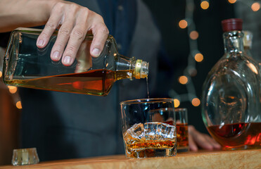 Bartender Serve Whiskey on wood bar