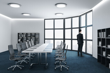Businessman standing in conference room