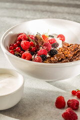 Breakfast chocolate oatmeal porridge with Labneh middle eastern lebanese cream cheese. Delicious homemade English breakfast concept for background.