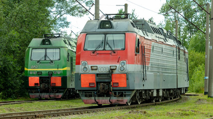 Fototapeta na wymiar two electric trains standing on the railway tracks in the depot