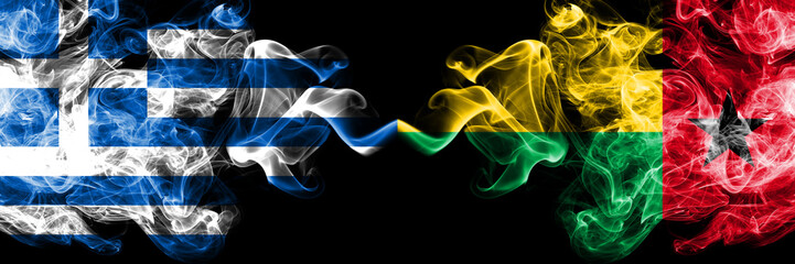 Greece vs Guinea Bissau smoky mystic flags placed side by side. Thick colored silky abstract smoke flags.