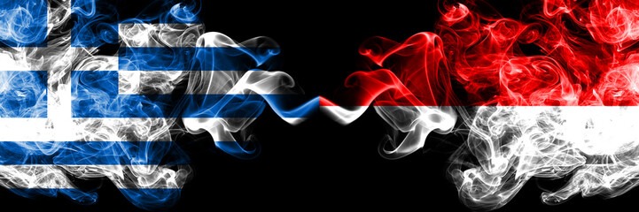 Greece vs Indonesia, Indonesian smoky mystic flags placed side by side. Thick colored silky abstract smoke flags.