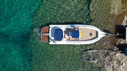 Aerial top view photo of inflatable speed boat on trailer being towed by truck from emerald exotic...
