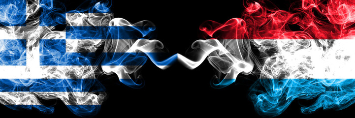 Greece vs Luxembourg smoky mystic flags placed side by side. Thick colored silky abstract smoke flags.
