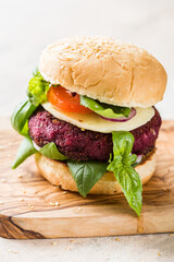 Veggie beet  burgers with vegetables and  greek sauce. Healthy food concept.