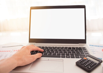 Man's hands typing on laptop keyboard with white background