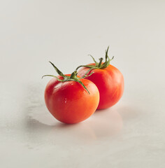 Fresh tomatoes shot on white background