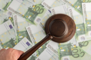 Judge hammer on Euro banknotes background. Judge gavel on the money. Corrupt court.