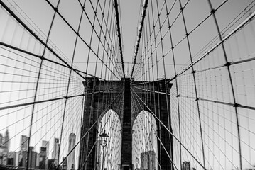 Grayscale shot of Brooklyn Bridge in New York