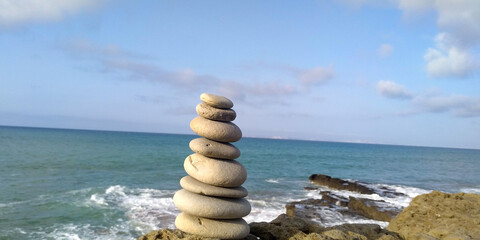 Fototapeta na wymiar stack of stones beside of beach rocky area