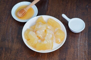 Boiled sweet potatoes, coconut milk and honey Thai dessert  