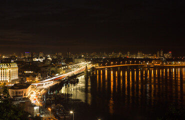 Beautiful View of the Dnieper river, Naberezhno-Kreschatitska street in Kiev, Ukraine. Night panorama of Kyiv
