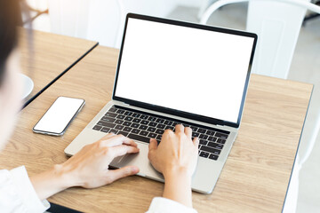 computer,cell phone mockup image.hand woman work using laptop texting mobile.blank screen with white background for advertising,contact business search information on desk in cafe.marketing,design