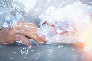 Social network theme hologram with businessman working on computer on background. Multi exposure.