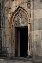 Fototapeta na wymiar Door with ancient ornaments entrance to the church