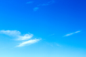 Fluffy white cloud flying on blue sky background