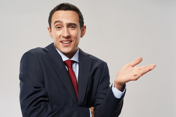 model business man in classic suit red tie gesturing with his hands