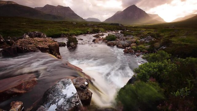 time lapse footage of the river coupall as it flows towards the valley of glencoe in the argyll region of the highlands of scotland in summer