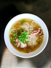 Bowls of Asian soup noodles and beef