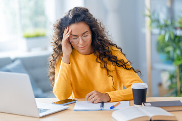 woman working on laptop at home.