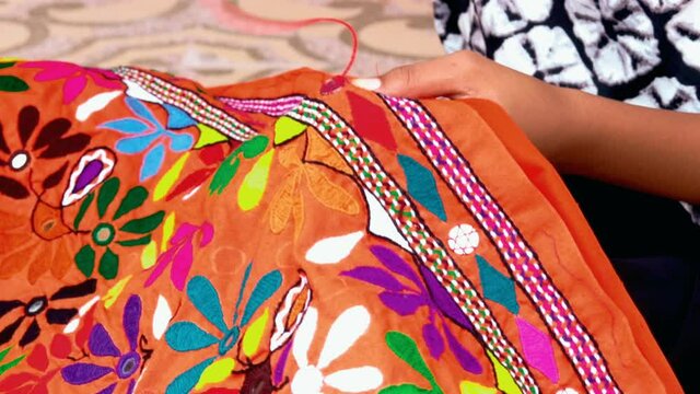 colorful handmade ahir bharat, kutchhi bharat,Mirrored embroidery work typical of the Ahir tribe in Gujarat, India,needlework,Colorful pattern and texture in cloth,
