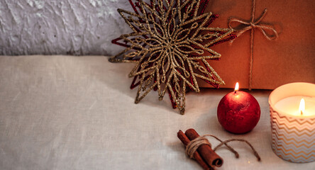 Christmas or new year composition. Christmas decorations in gold and red colors with copy space for text. Holiday and celebration concept for postcard or invitation.