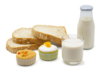 Obraz na płótnie Canvas Milk , bread and small cake for snack time, isolated on white background.