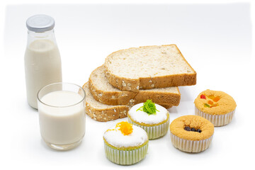 Milk , bread and small cake for snack time, isolated on white background.