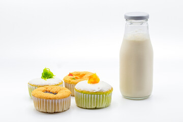 Milk , bread and small cake for snack time, isolated on white background.
