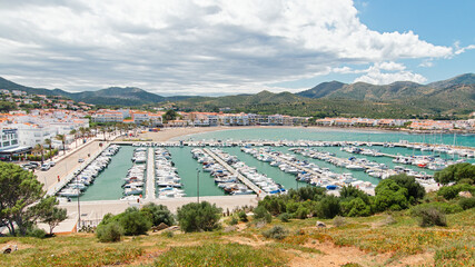 Yachts parking or port with yachts and sailboats, view from above. Mediterranean village with port