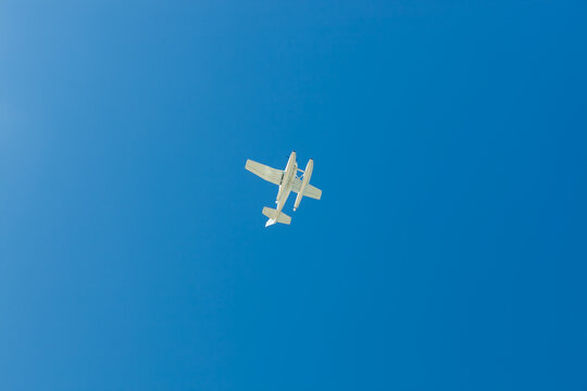 White Seaplane Overhead Against A Blue Cloudless Sky